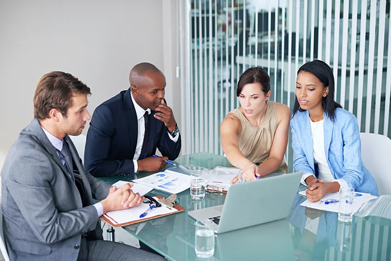 Corporate restructuring meeting with people around a table